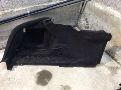 Обшивка багажника боковая левая 