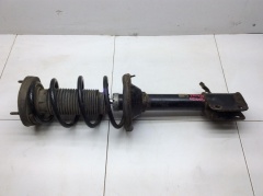 Амортизатор задний левый в сборе с пружиной KYB Excel-G 