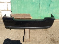 Бампер задний в сборе с юбкой и парктрониками 
