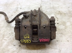 Суппорт тормозной передний правый со скобой Митсубиси Carisma (DA) 2000-2003 M863312